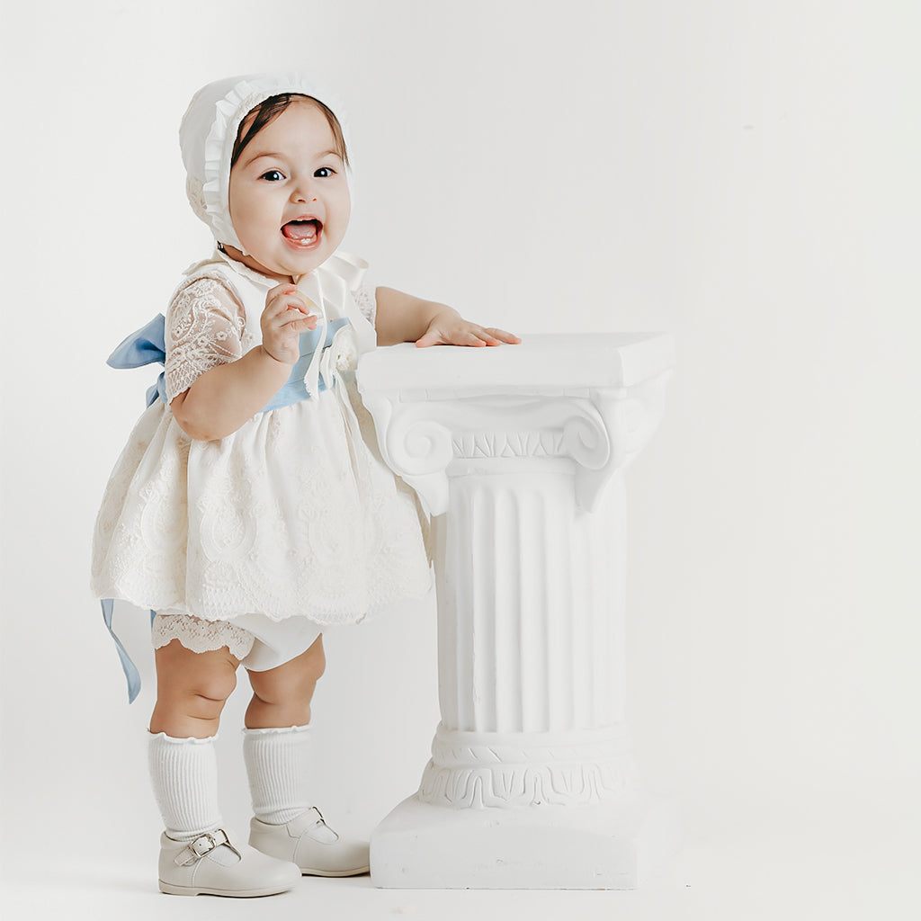 Baby girl dress with embroidered details and bow in linen. (9mths-18mths) Baby girl dress with embroidered details and bow in linen. (9mths-18mths)
